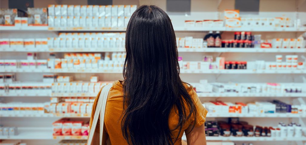 woman in store looking at supplements